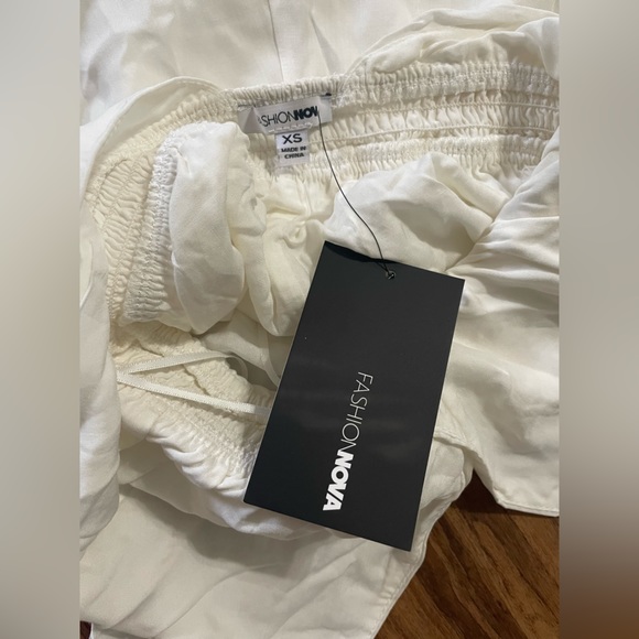 NWT Fashion Nova Eyelet Bell Bottom Festival Babe Halter Jumpsuit White Boho - Picture 11 of 11